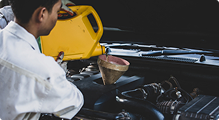 close up auto mechanic hand pouring replacing fresh oil into car engine auto repair garage automobile maintenance industry concept 1